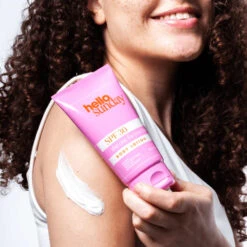 **SALE** HELLO SUNDAY - SPF 30 Moisturising Body Lotion(Hello Sunday Spf 30 Moisturising Body Lotion) 11 **SALE** HELLO SUNDAY - SPF 30 Moisturising Body Lotion(Hello Sunday Spf 30 Moisturising Body Lotion) -TILT Makeup TheOneForYourBody SPFBodyMoisturiser ModelHoldingBottle